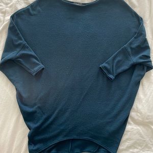 Jolie size XS loose sleeve sweater in a navy type color.